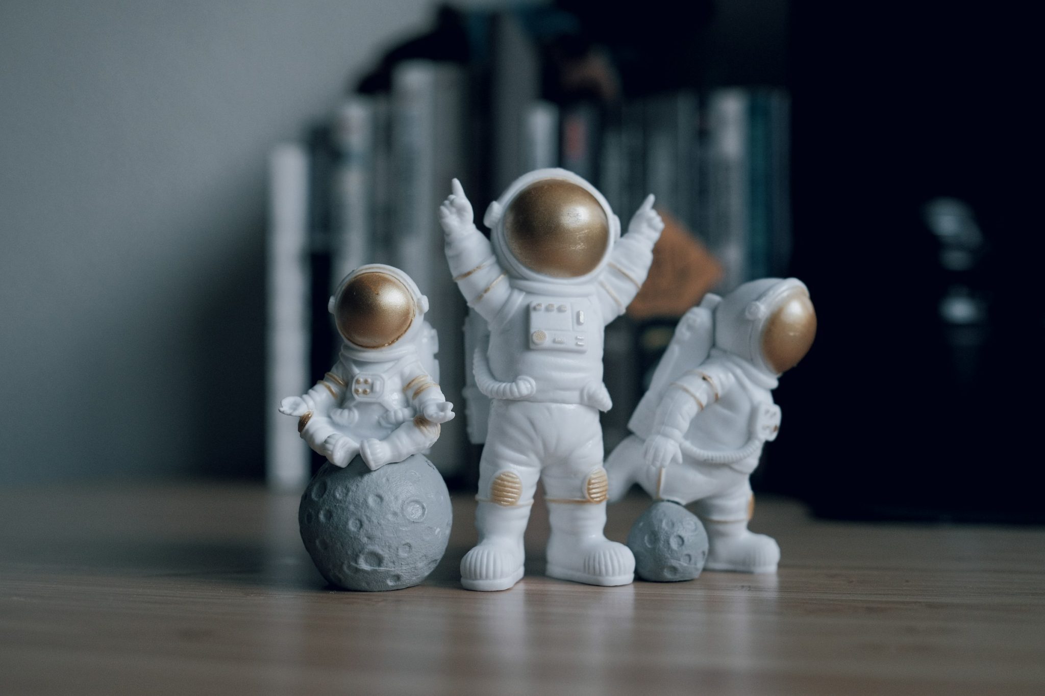 Astronaut figurines playing with asteroids Laws in space